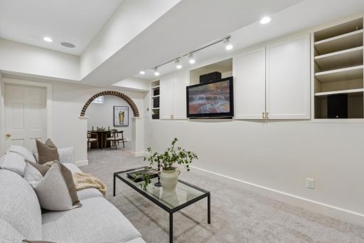 Lower-level family room with built-ins for movie nights