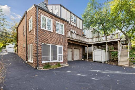 Two-car tuck-under garage and storage shed