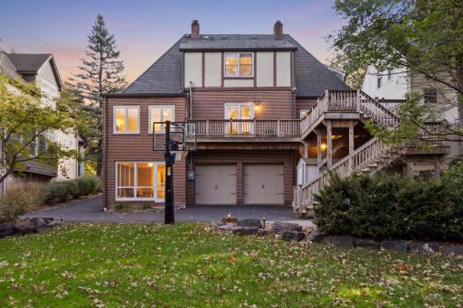 Back of the home with deck and walkout lower level
