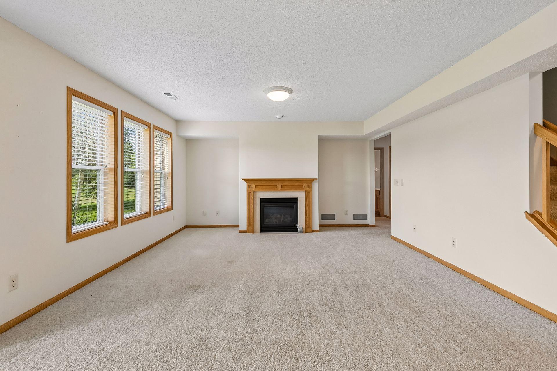 lower level family room with gas fireplace