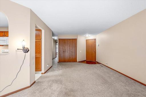 Interior view of front door and living room down the hall to the bedrooms