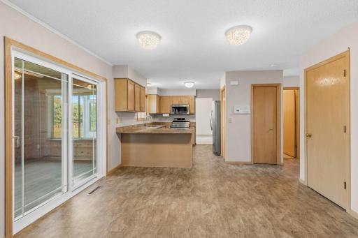 Informal Dining-Kitchen and powder room to right