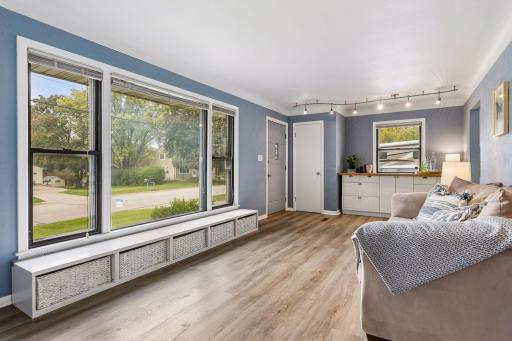 Living Room with Built in Bar Area and Front Door