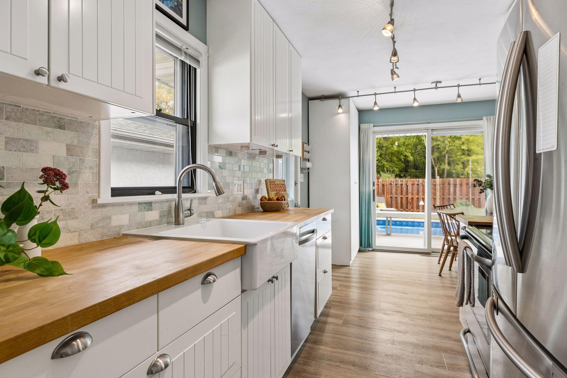 Galley Kitchen with View of the Pool