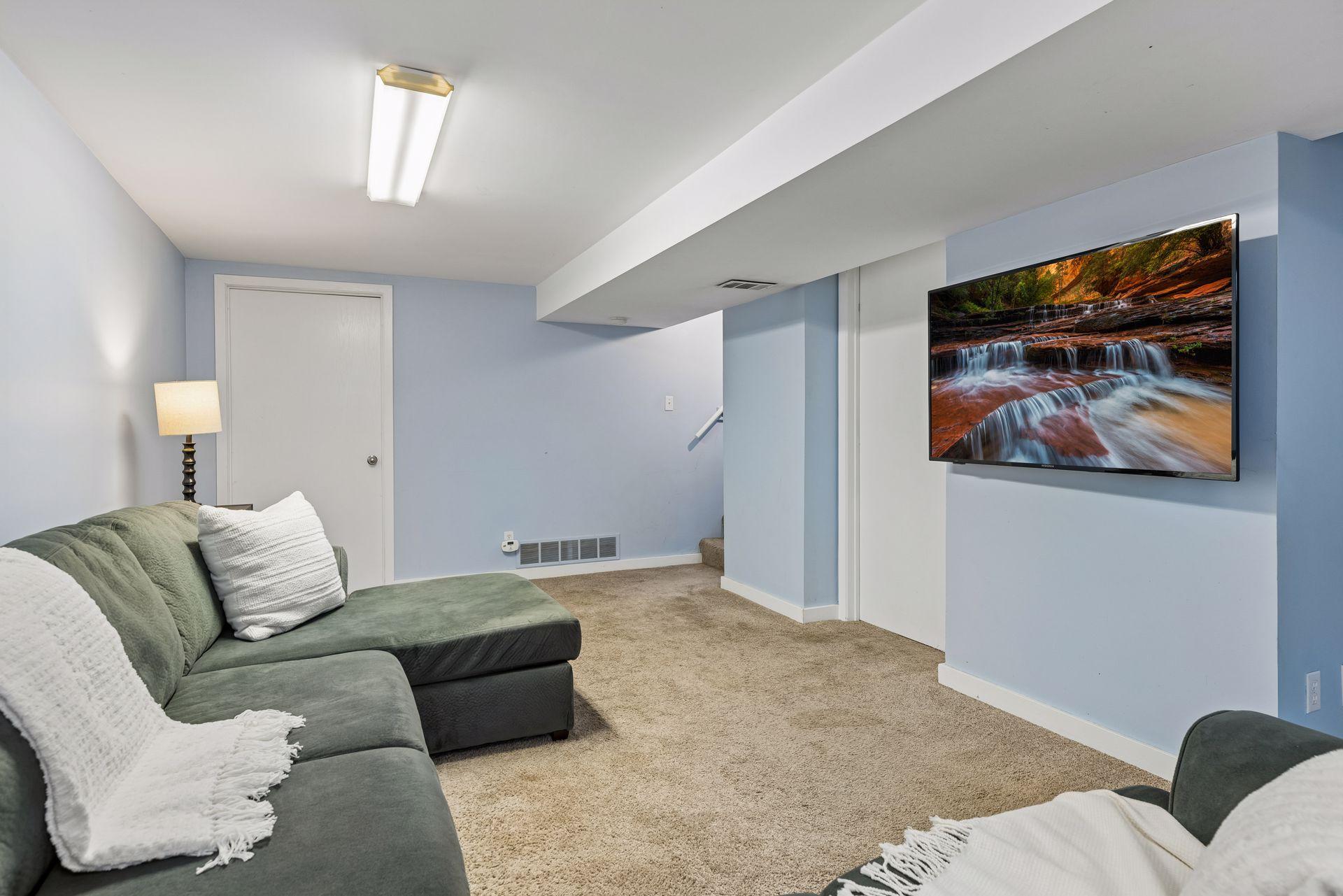 Lower Level Family Room with Access to Storage Room and Laundry Room