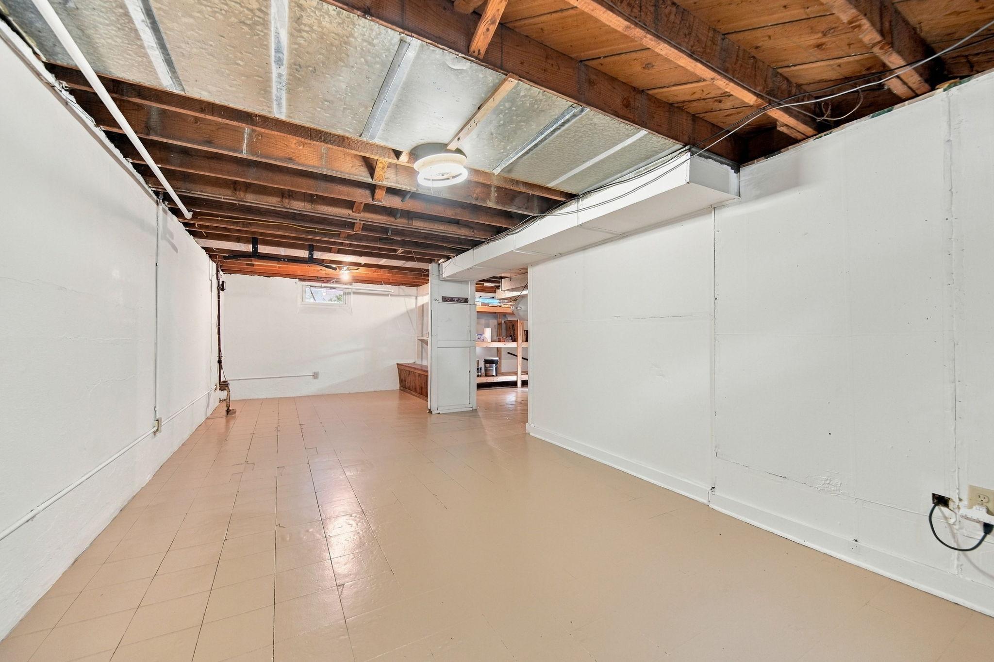 The unfinished lower level offers new owners the opportunity to add value and build equity by finishing the space to suit their needs and style.