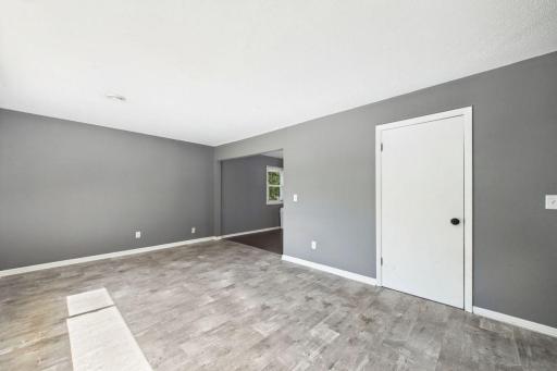 Living room showing the laudry and utility room