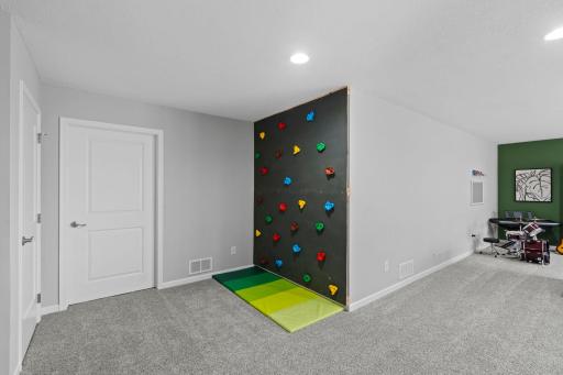 Doors leading to Additional Lower Level Storage and Mechanical Room w/ Additional Storage
