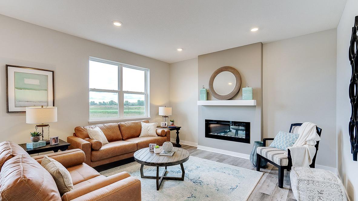 Welcome to the Holcombe! Get comfortable in the fantastic main level living room. *Photo is of a model home, colors may vary in actual home.