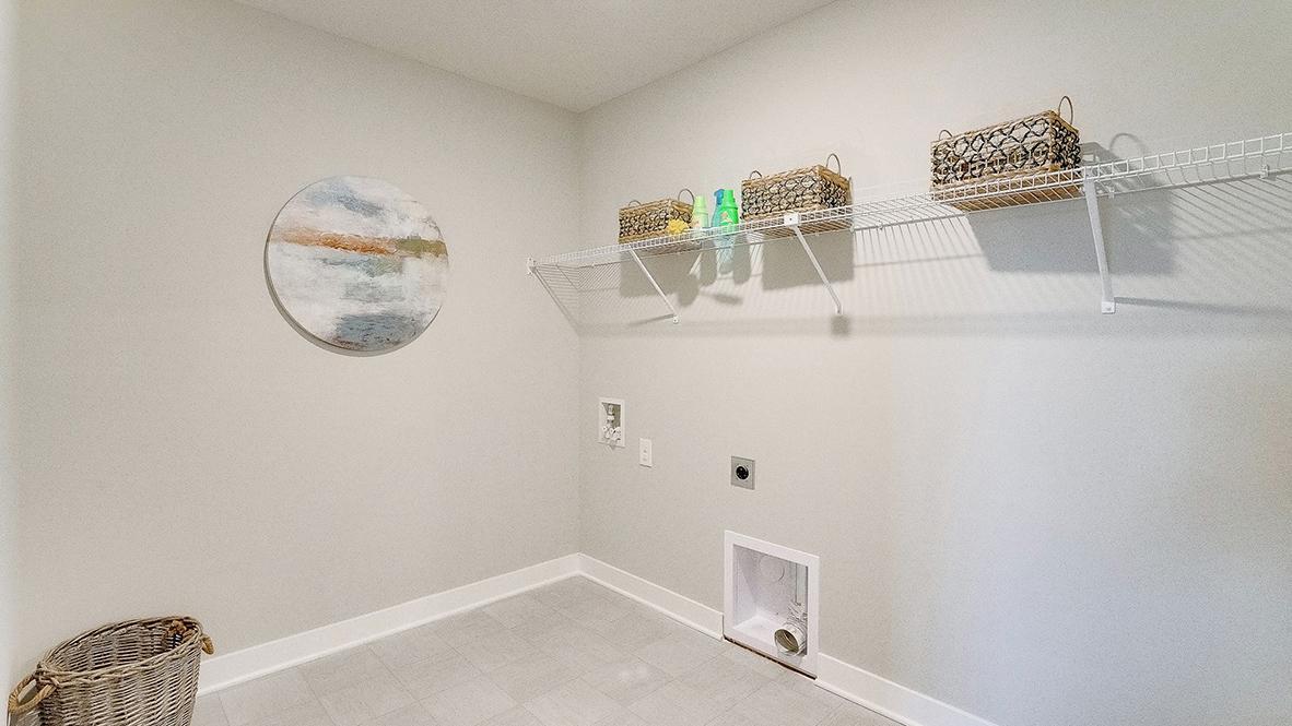 Conveniently located upstairs, near the bedrooms is the laundry room. *Photo is of a model home, colors may vary in actual home.