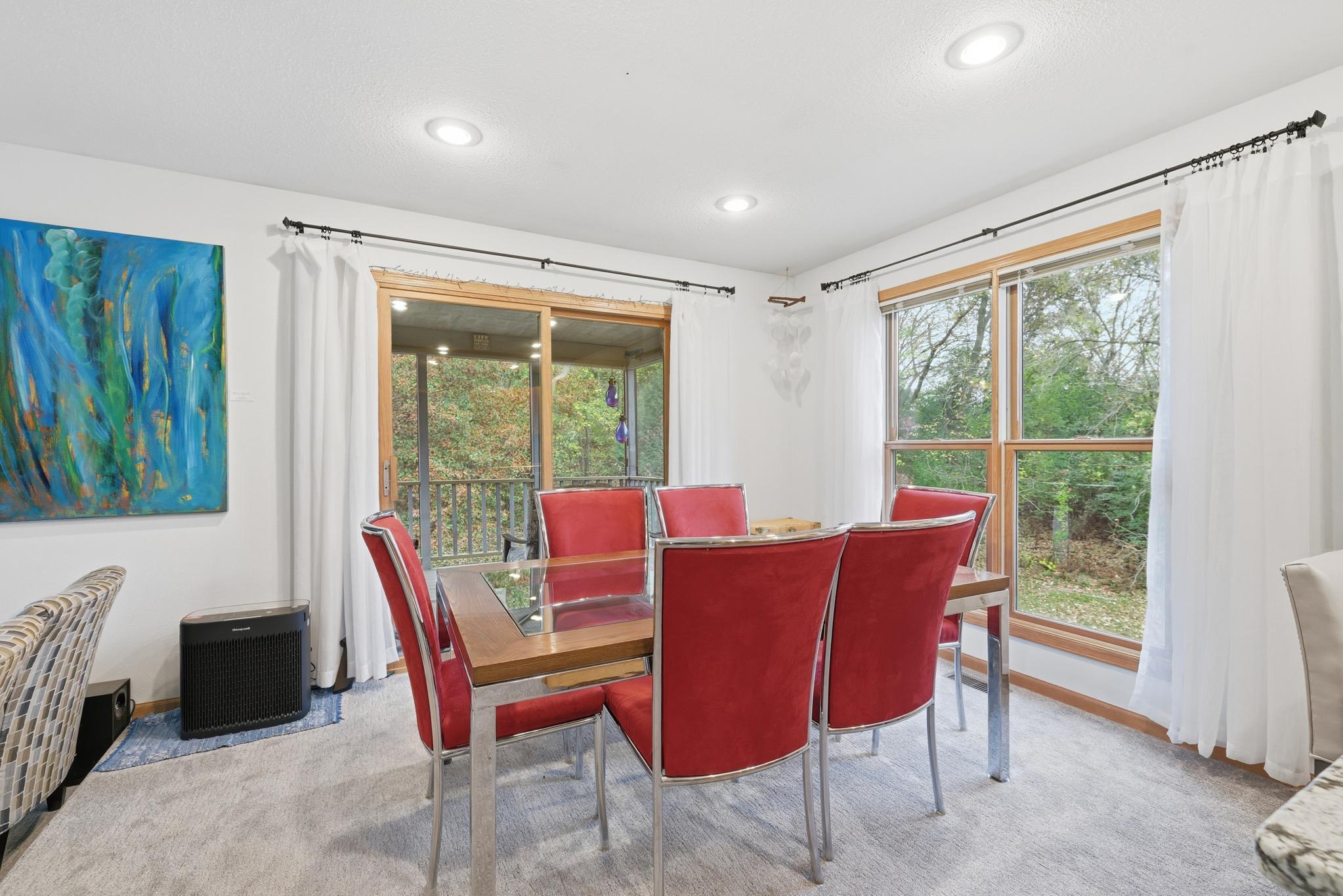 Spacious dining room with patio door to the screened deck