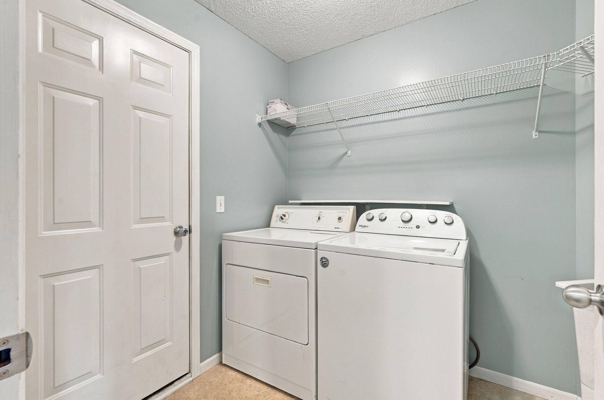 Main Level Laundry, Mud Room leading to attached 2 Car Garage