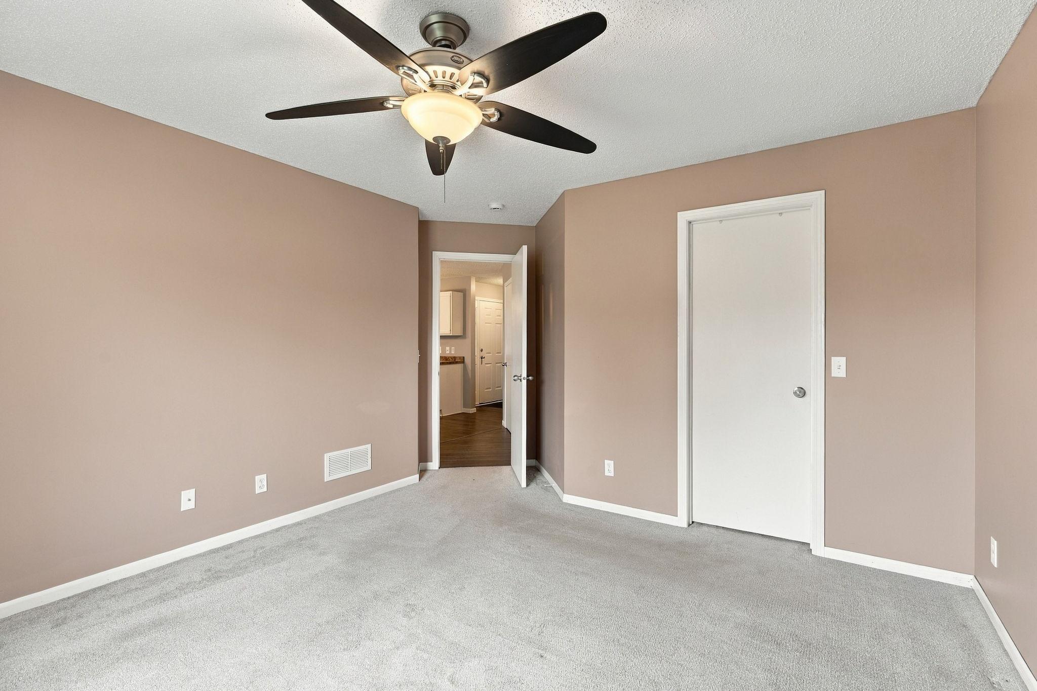 Spacious Main-Floor Primary Suite with a Walk-in Closet.