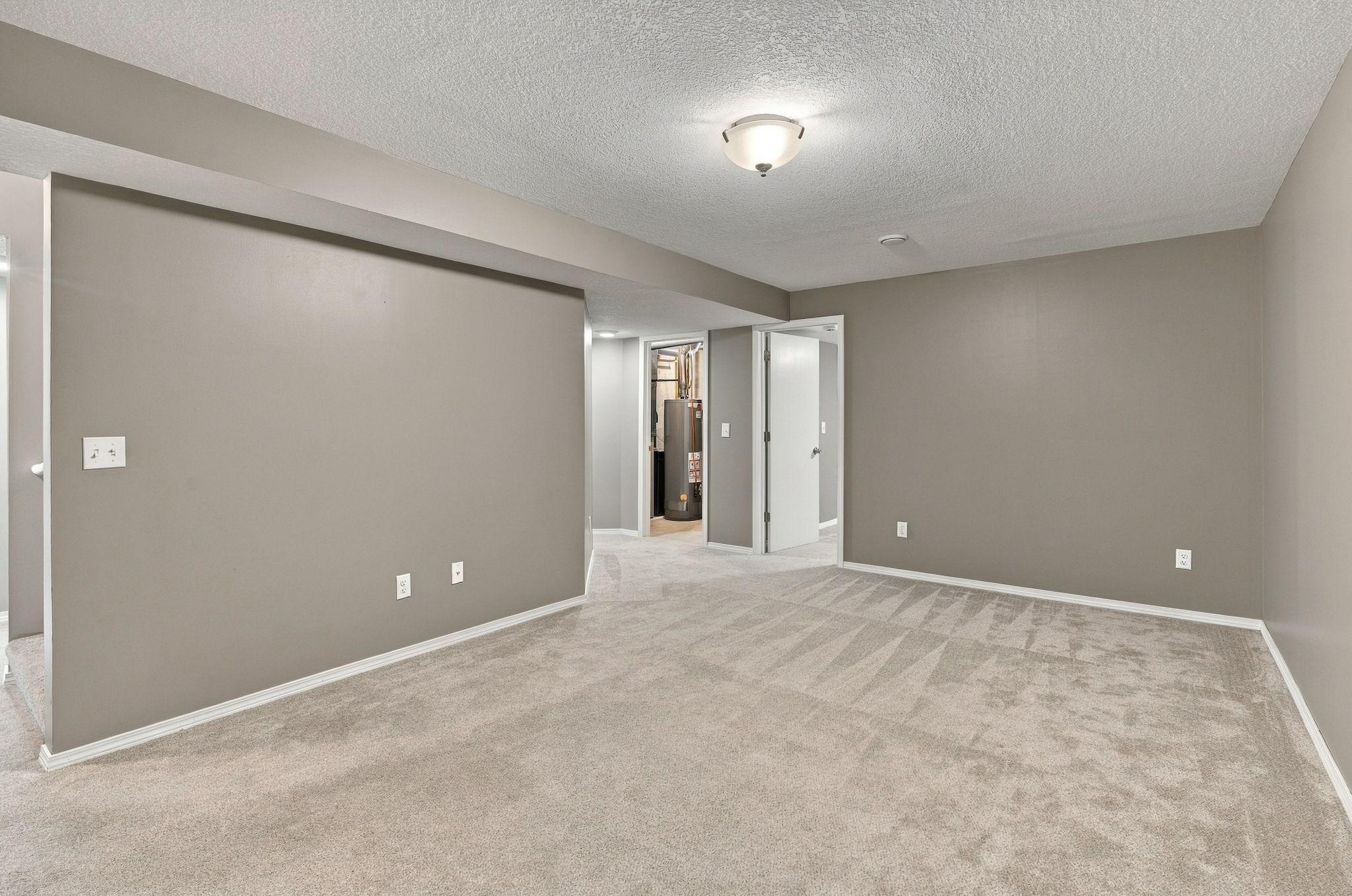 Finished basement that includes a large bedroom, additional living space and extra storage to keep everything organized.