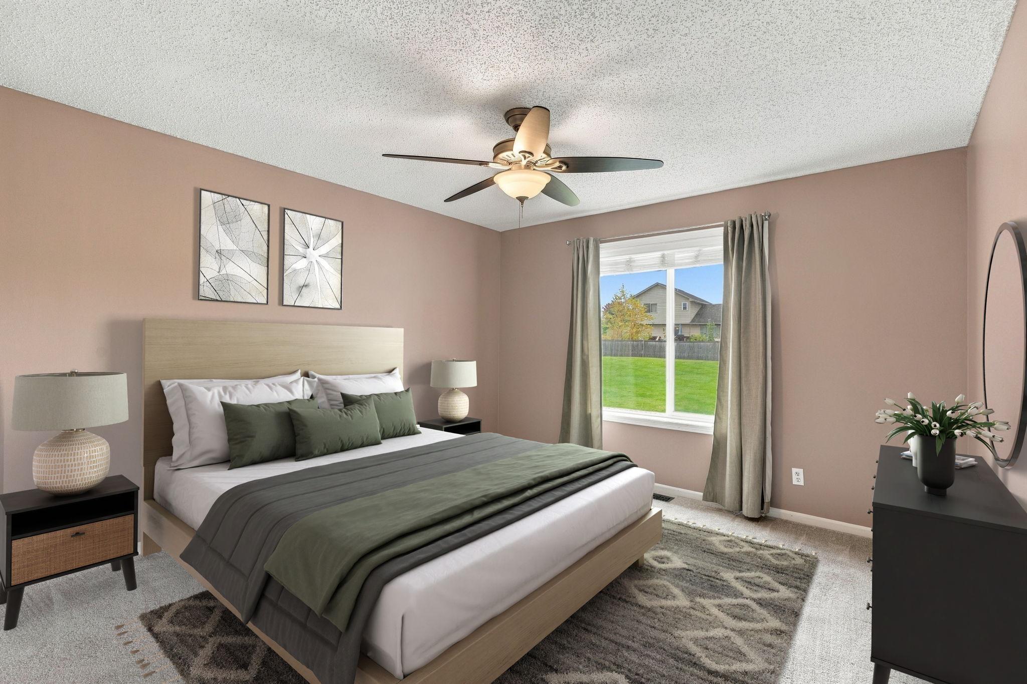 Spacious Main-Floor Primary Suite with a Walk-in Closet. (Virtual Staged)