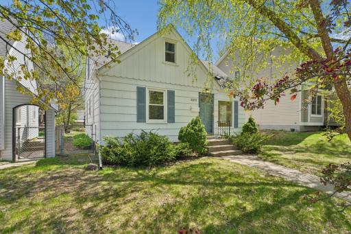 Front exterior with dormer detail and full lot view