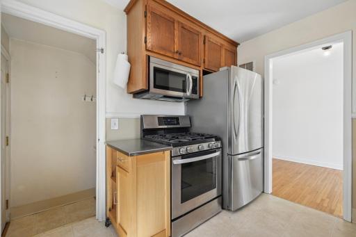 Updated stainless appliances â gas range, French-door fridge, and microwave