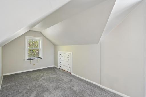 Built-in storage drawers under the dormer window