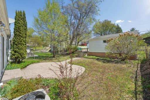 Backyard view toward the detached garage and alley access