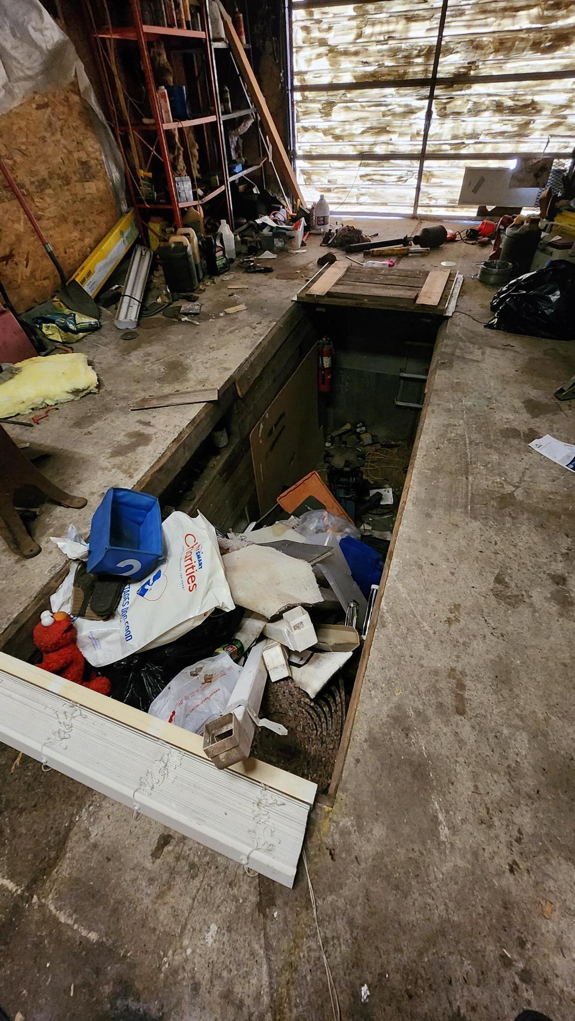 oil changing pit in the garage, no cover
