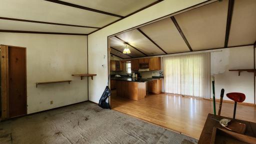 facing the dining area from the living room, sliding glass doors go out to a covered porch