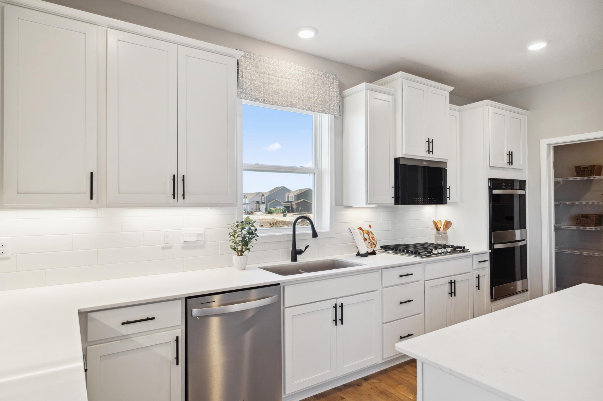 Abundant cabinets and counter top spaces.
