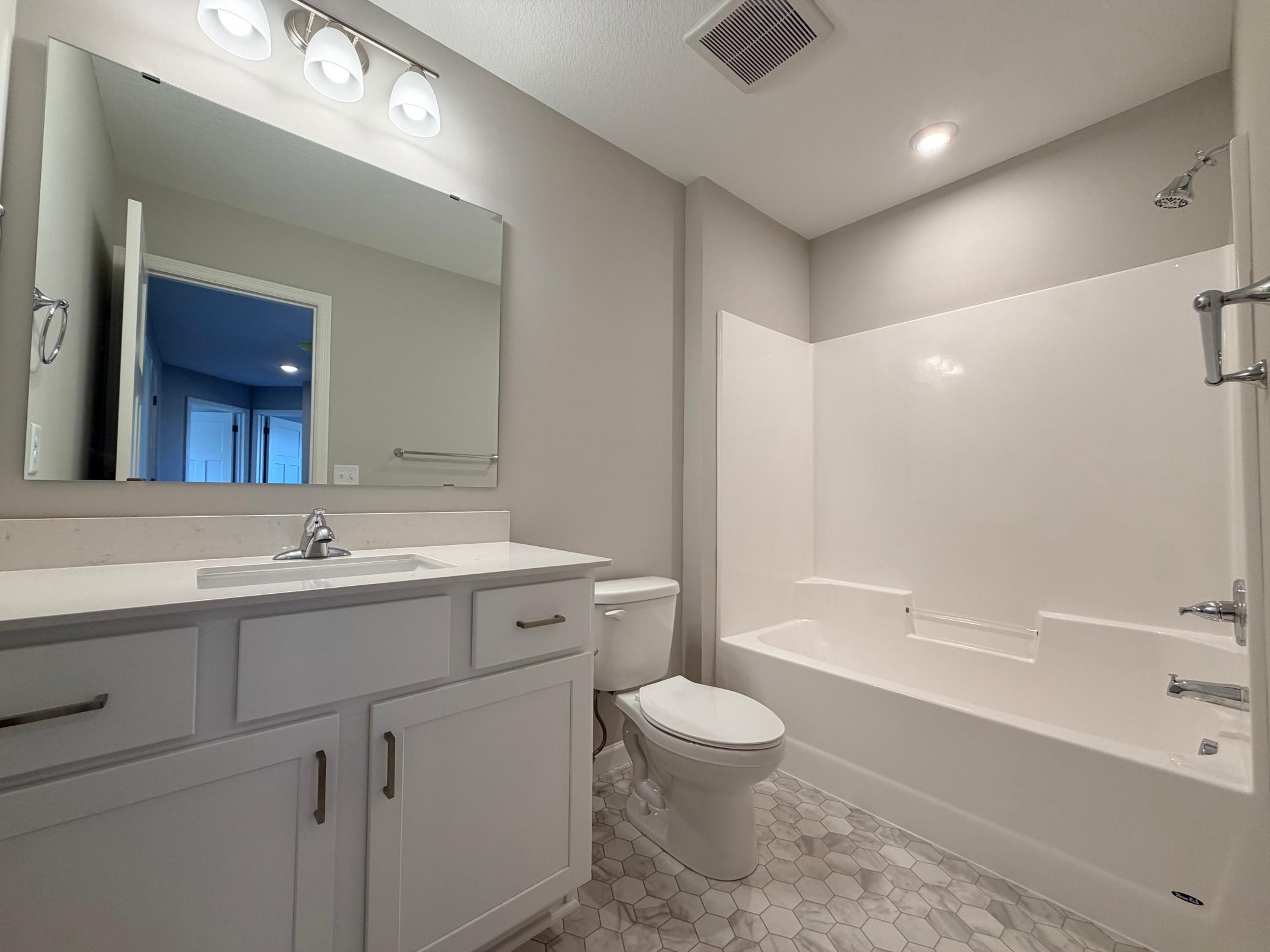 Main bath on upper level.