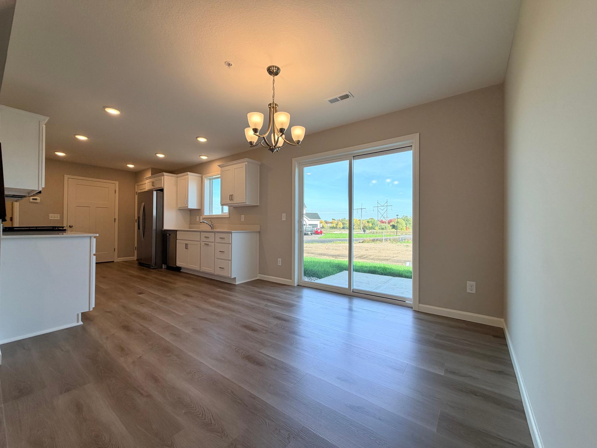 Open concept main level with effortless flow between living, dining and kitchen space.