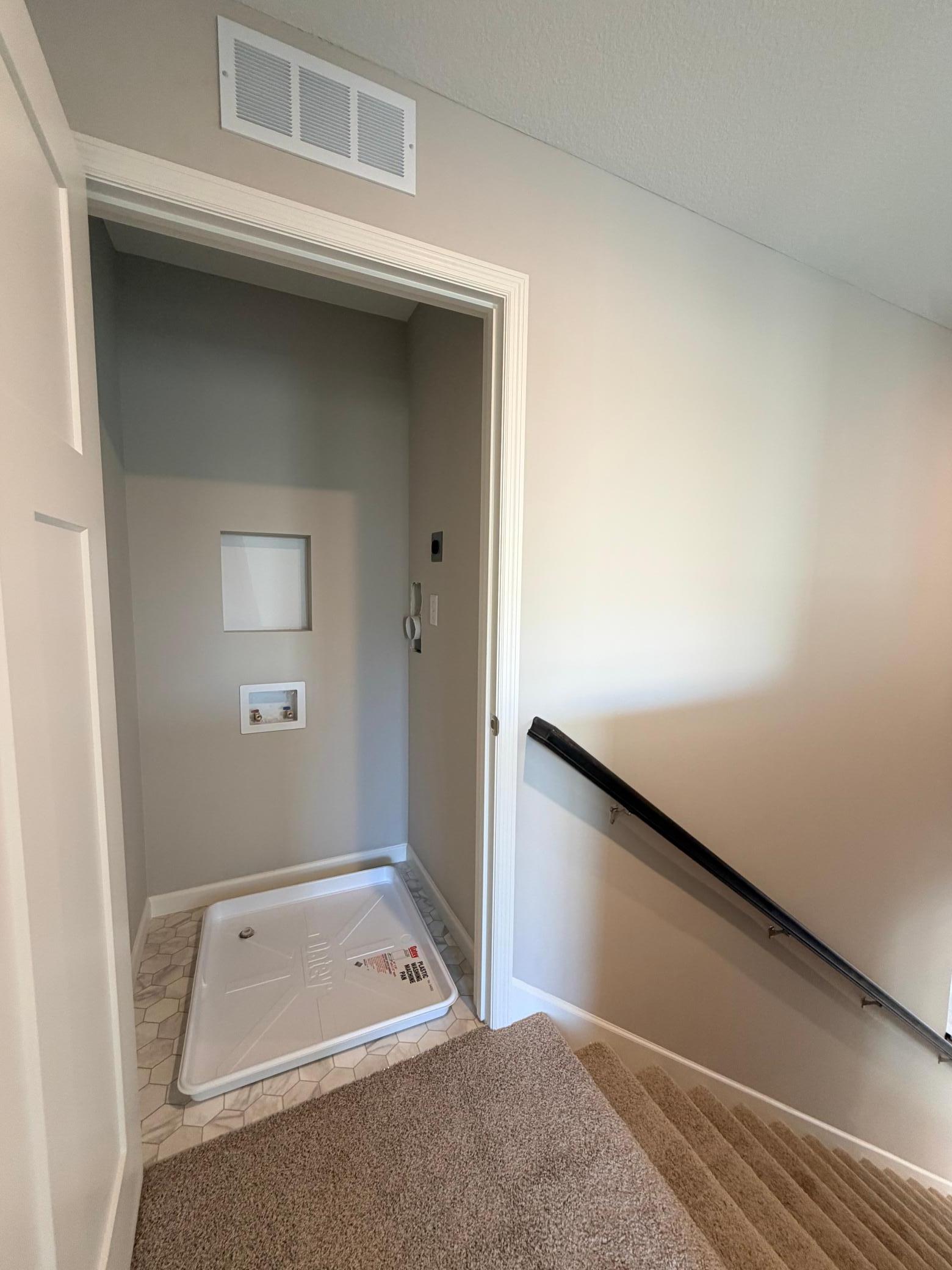 Laundry closet located on upper level for convenience.