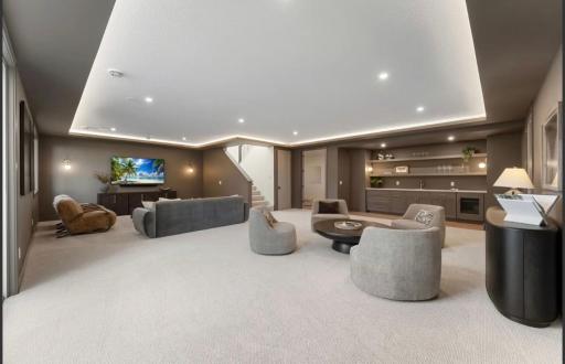 Lower level with tray lighting-not actual home, photos of model with same layout