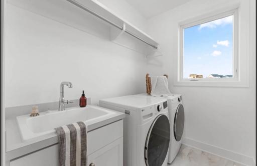 Main level laundry-not actual home, photos of model with same layout