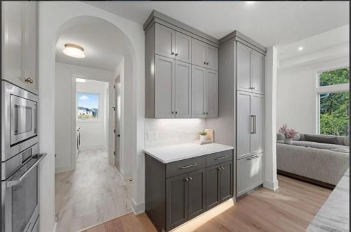 Kitchen with arched hallway- not actual home, photos of model with same layout