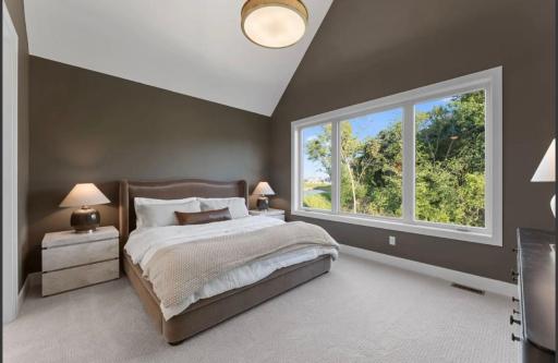 Primary Bedroom with vaulted ceiling-not actual home, photos of model with same layout