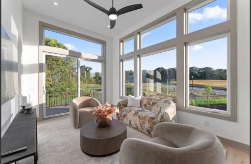 Sunroom with sliding doors out to deck-not actual home, photos of model with same layout