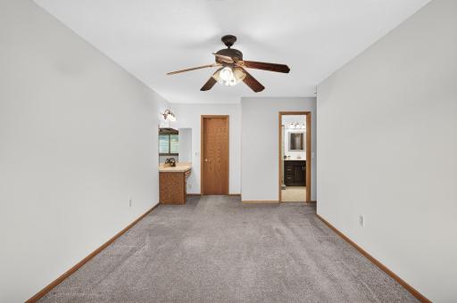 Door to bathroom and walk-in closet from primary bedroom