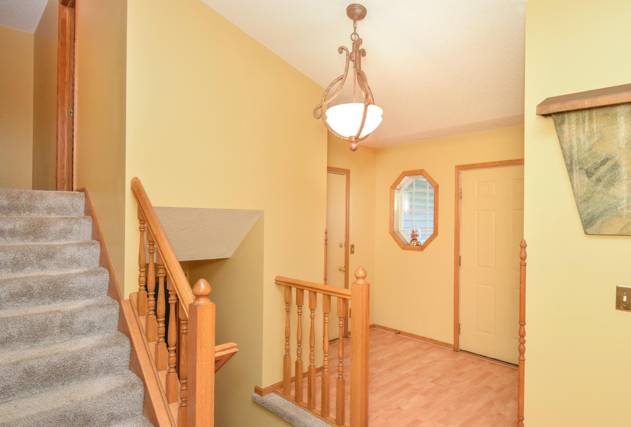 Front Entrance with Stairs to Lower Level and Upper Level. Living Room is to the Right.jpg