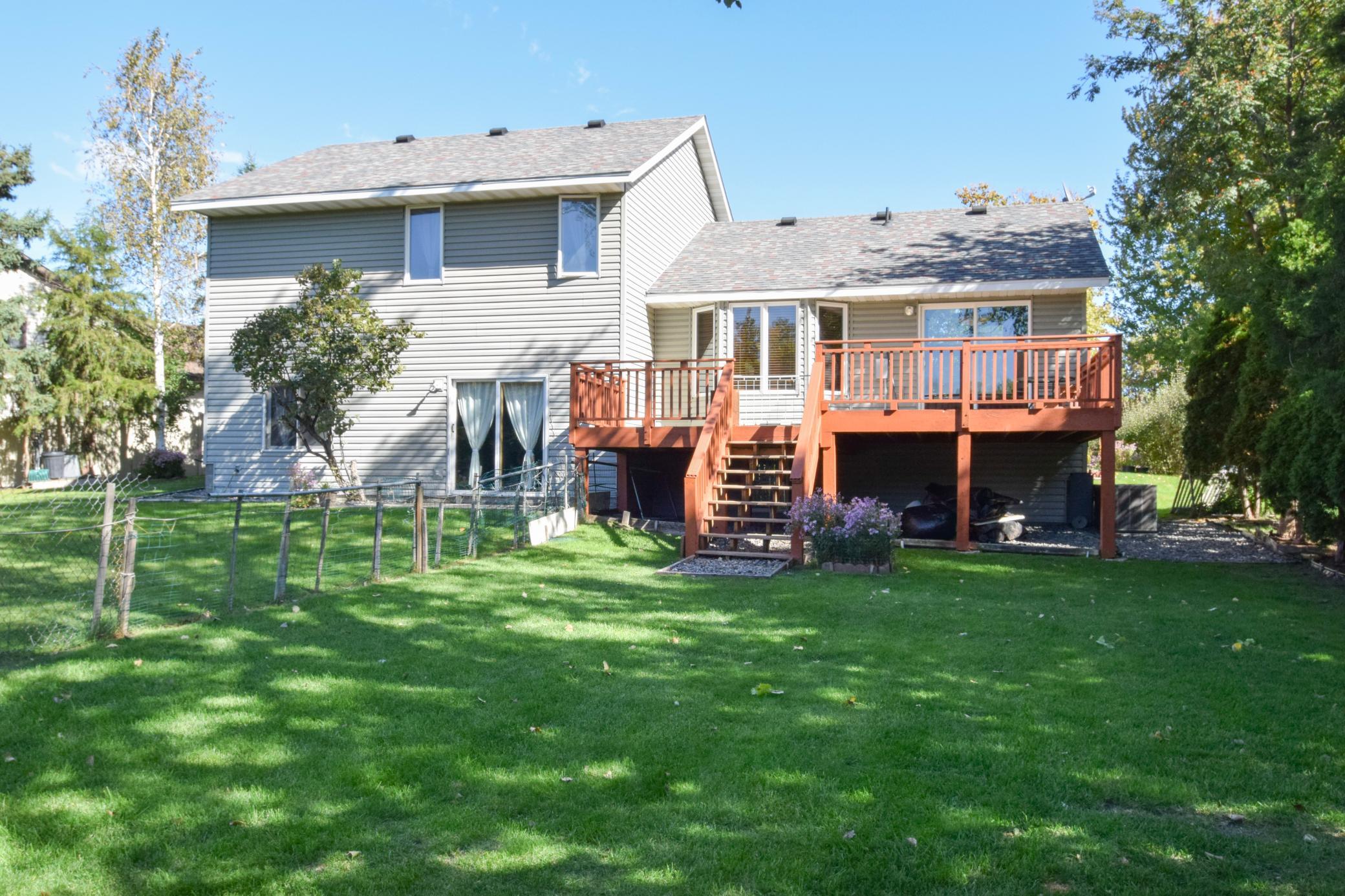 Backyard with Deck and Walk Out from Lower Level.jpg