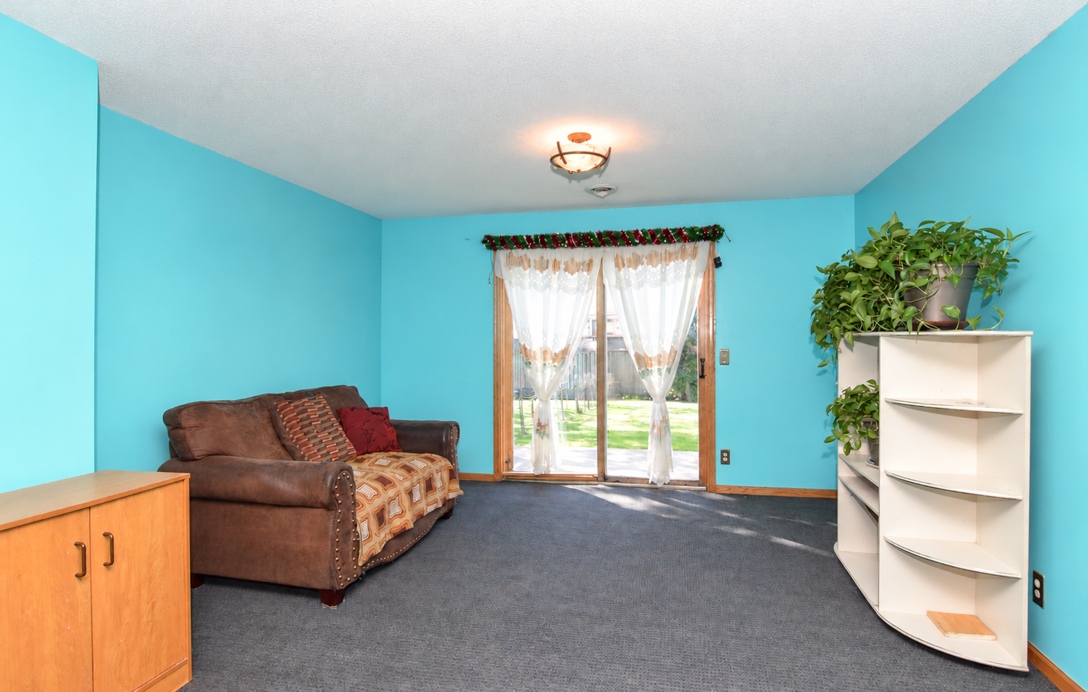 Family Room with Walk Out - Lower Level. AI Enhanced.png