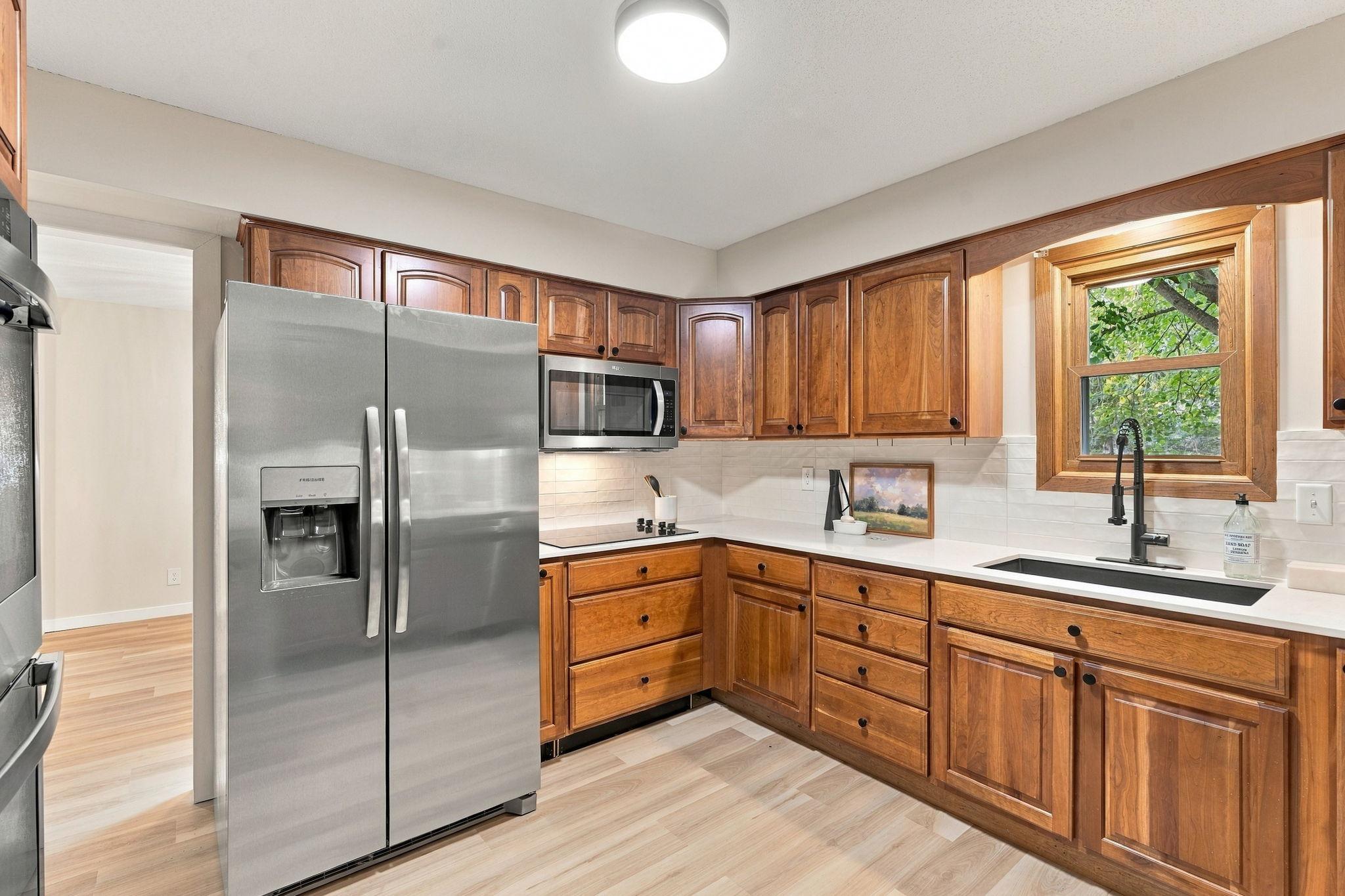 Kitchen with New Appliances, Countertops, Backsplash and More