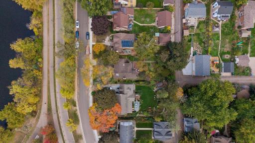 Overhead aerial of East Como Boulevard, the Como Lake walking path, and surrounding Como Park blocks.