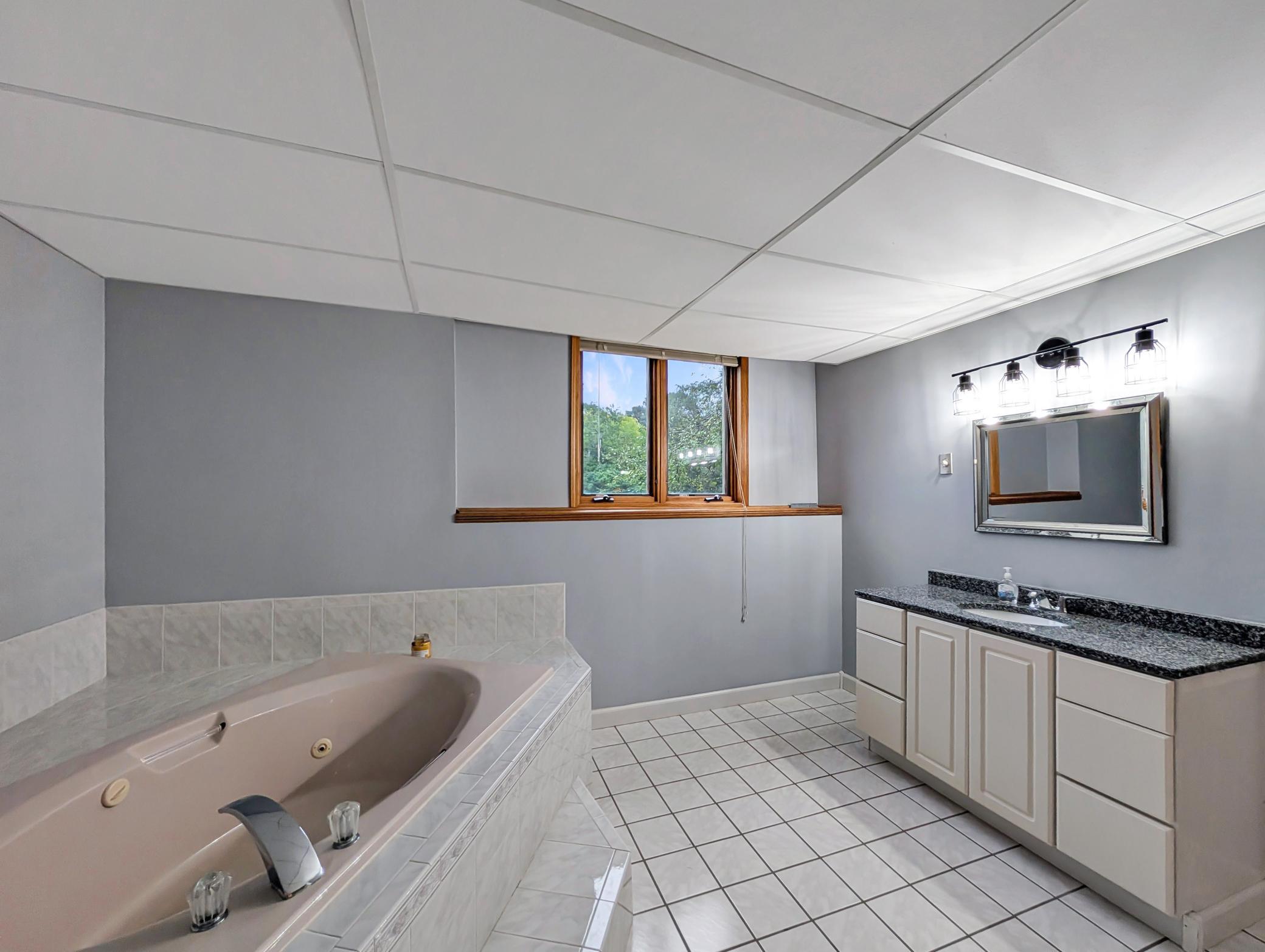 Also features a vanity with plenty of storage!
