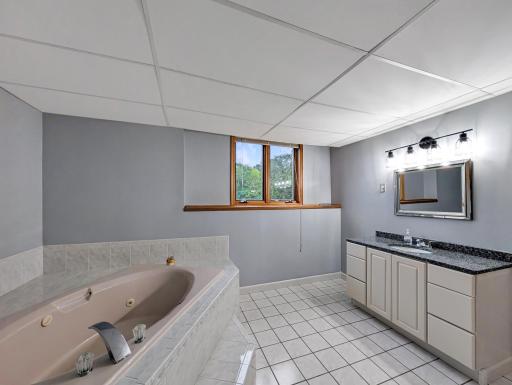 Also features a vanity with plenty of storage!