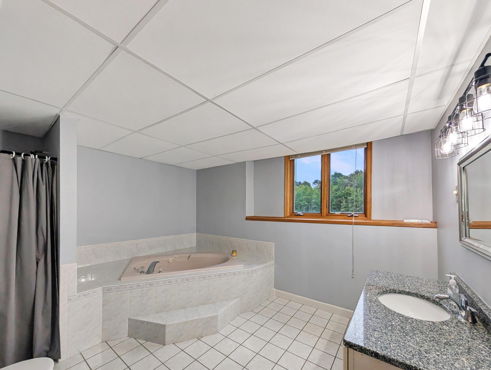 Basement also features a spacious bathroom with a jet tub and shower!
