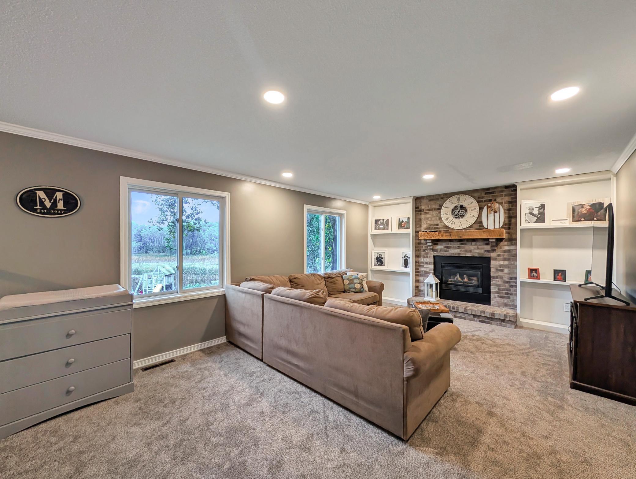 This family room stays bright with large windows!