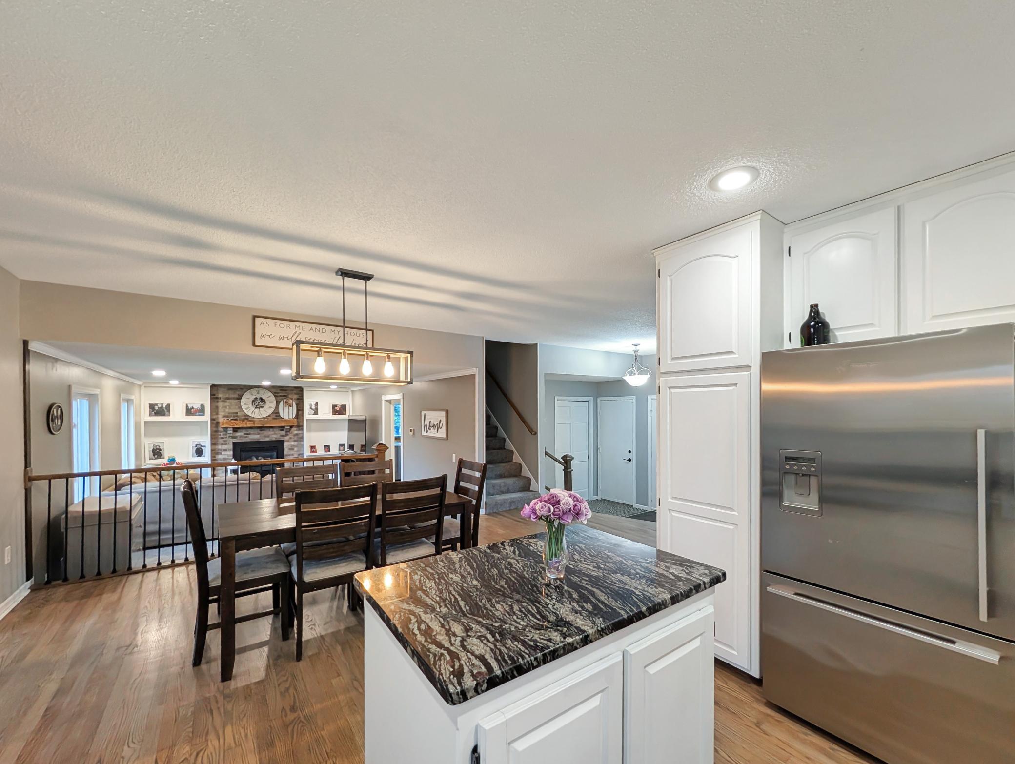 Room for pantry items right next to the fridge makes this convenient and functional as well as stunning.