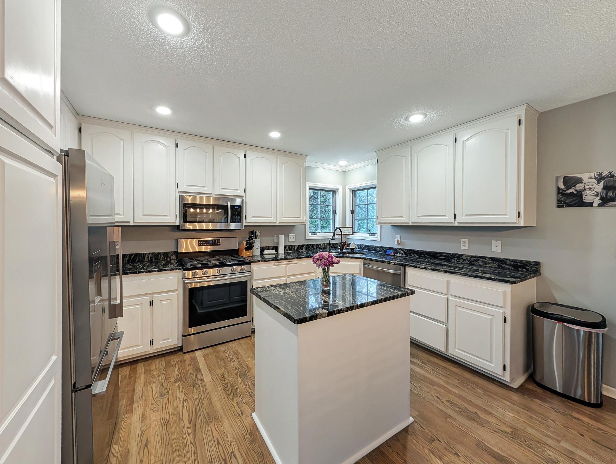 This kitchen features ample storage and recessed lighting, keeping things bright and clean!
