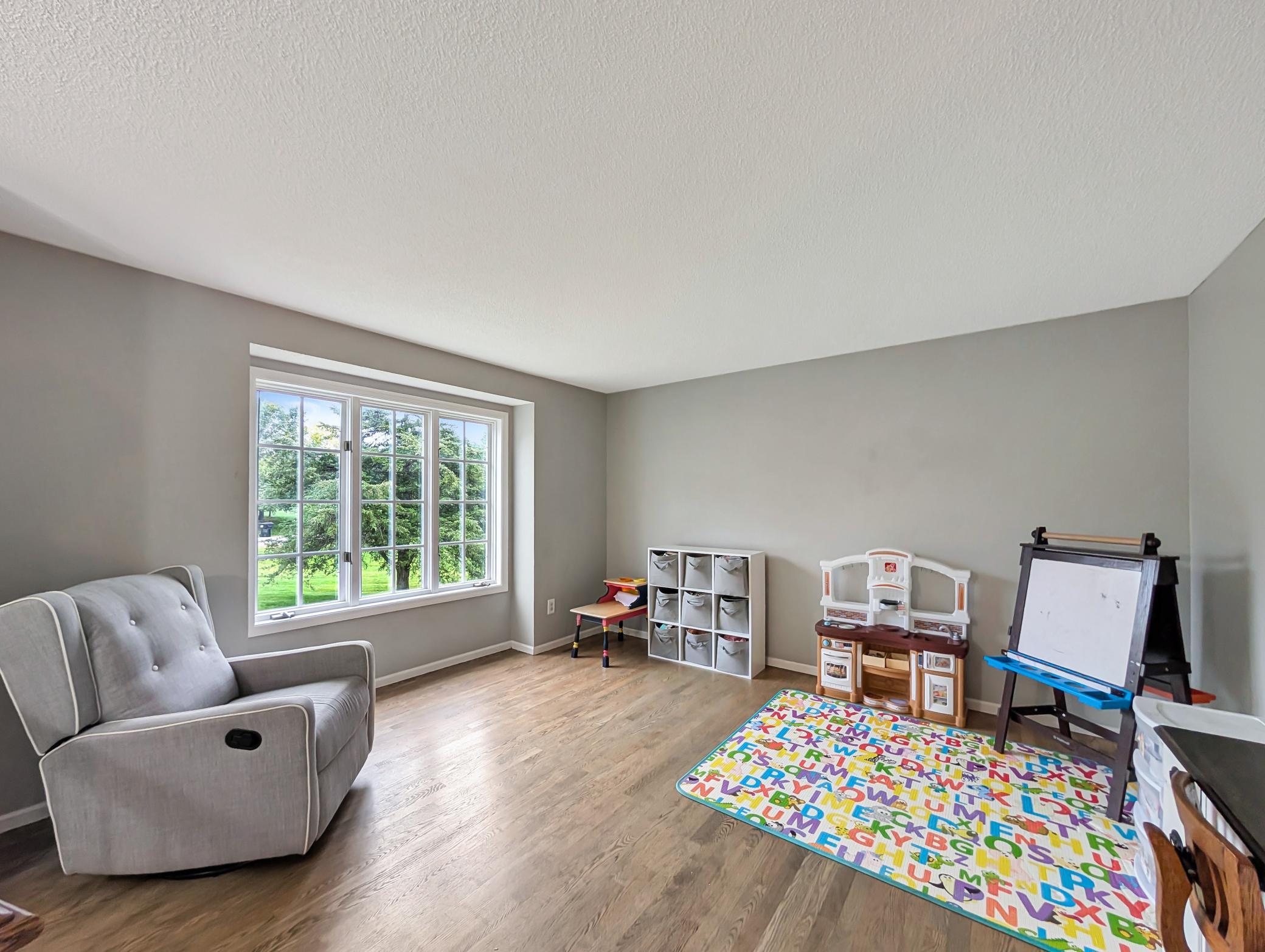 This space is primed for your personal touch to make it your own cozy living room!
