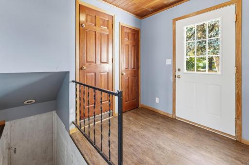 Breezeway with a cedar closet and entrance to house and lower level