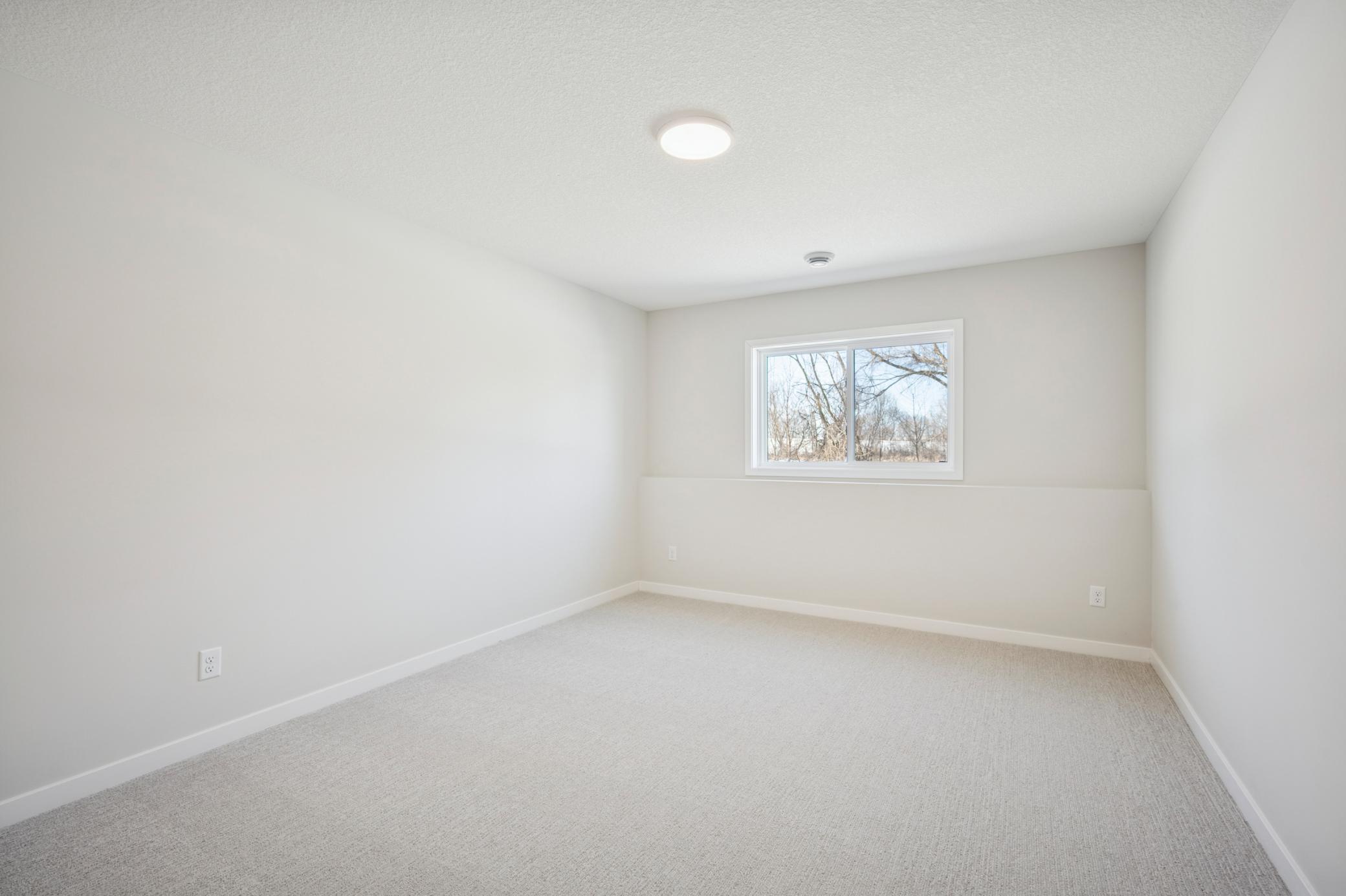 You will Love this Finished Lower Level! includes, spacious Family room, game area, and another bedroom, bathroom and large storage room!