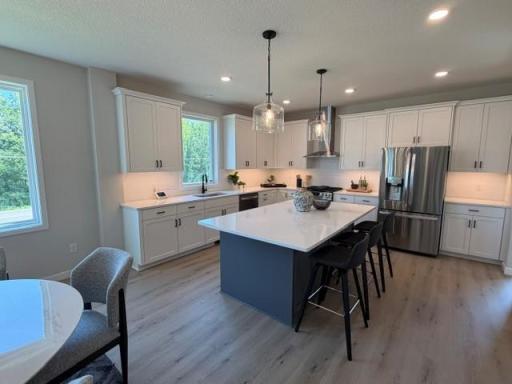 New Robert Thomas Home! 5 bedrooms & 3-car garage. Quick Move in home Available Fall! Enjoy cooking & entertaining in this beautiful super-sized kitchen! & Custom Cabinets w/soft close doors & drawers, throughout! Get settled B-4 Winter!